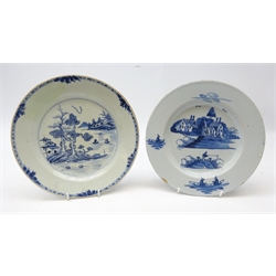  18th century Delft tin glazed plate painted in blue in the Chinese style, with figures fishing and houses in the distance, D23cm and another 18th century tin glazed plate decorated with river scene (a/f) (2)  