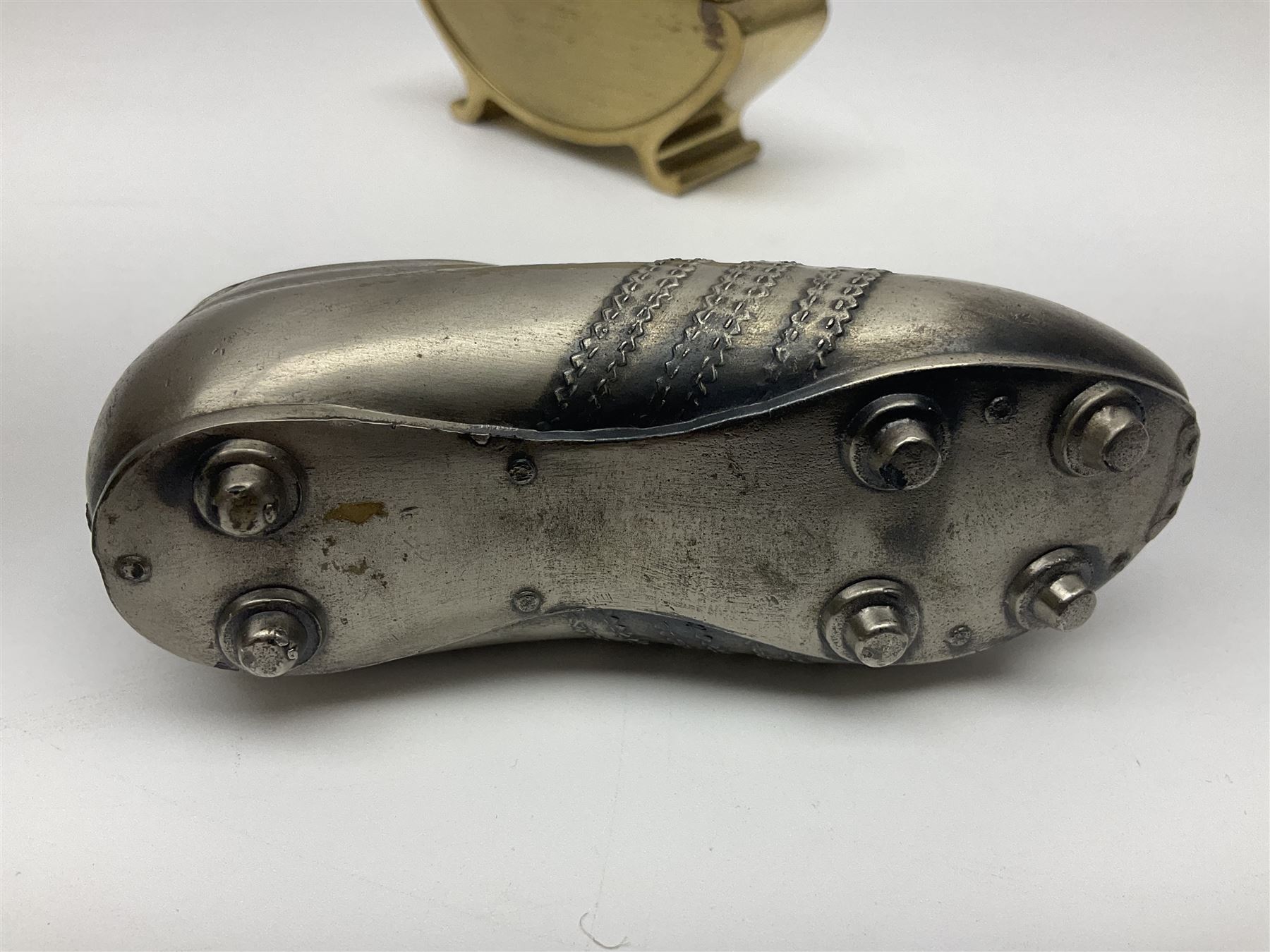 Ronson gilt metal table lighter, together with a silver-plate table lighter in the form of a football boot