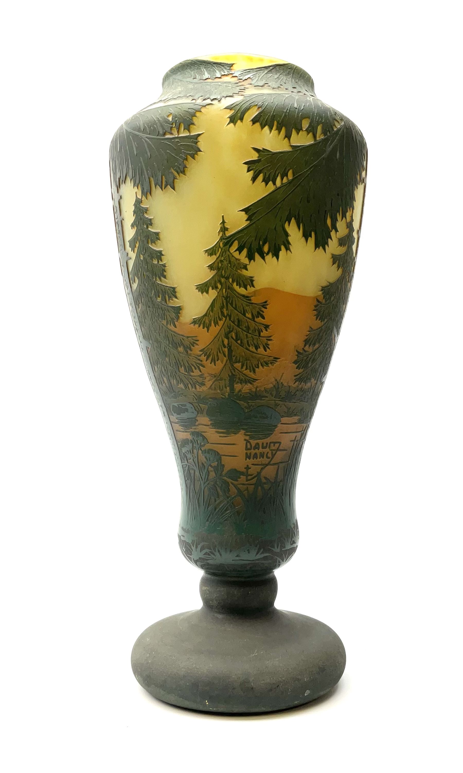 Reproduction Daum Nancy art nouveau  style overlay and cut glass vase in ovoid form with a circular base, decorated with woodland and mountain scene, H38.5cm. 