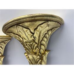 Pair of carved giltwood wall shelves, upon carved foliate pillars, L43cm