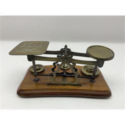 Set of brass postal scales, on wooden base