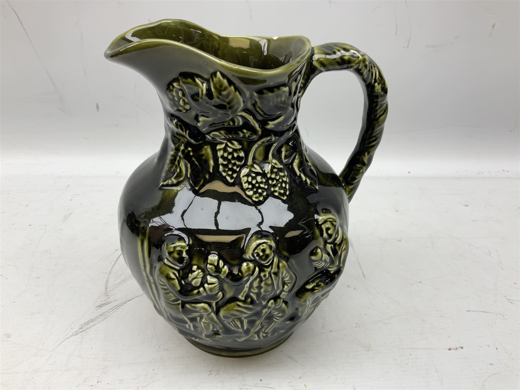 Three jardinières comprising West German Gerz example decorated in relief, Doulton Slaters example with frilled everted rim and a majolica example, and a further two Arthur Wood majolica jugs (5)