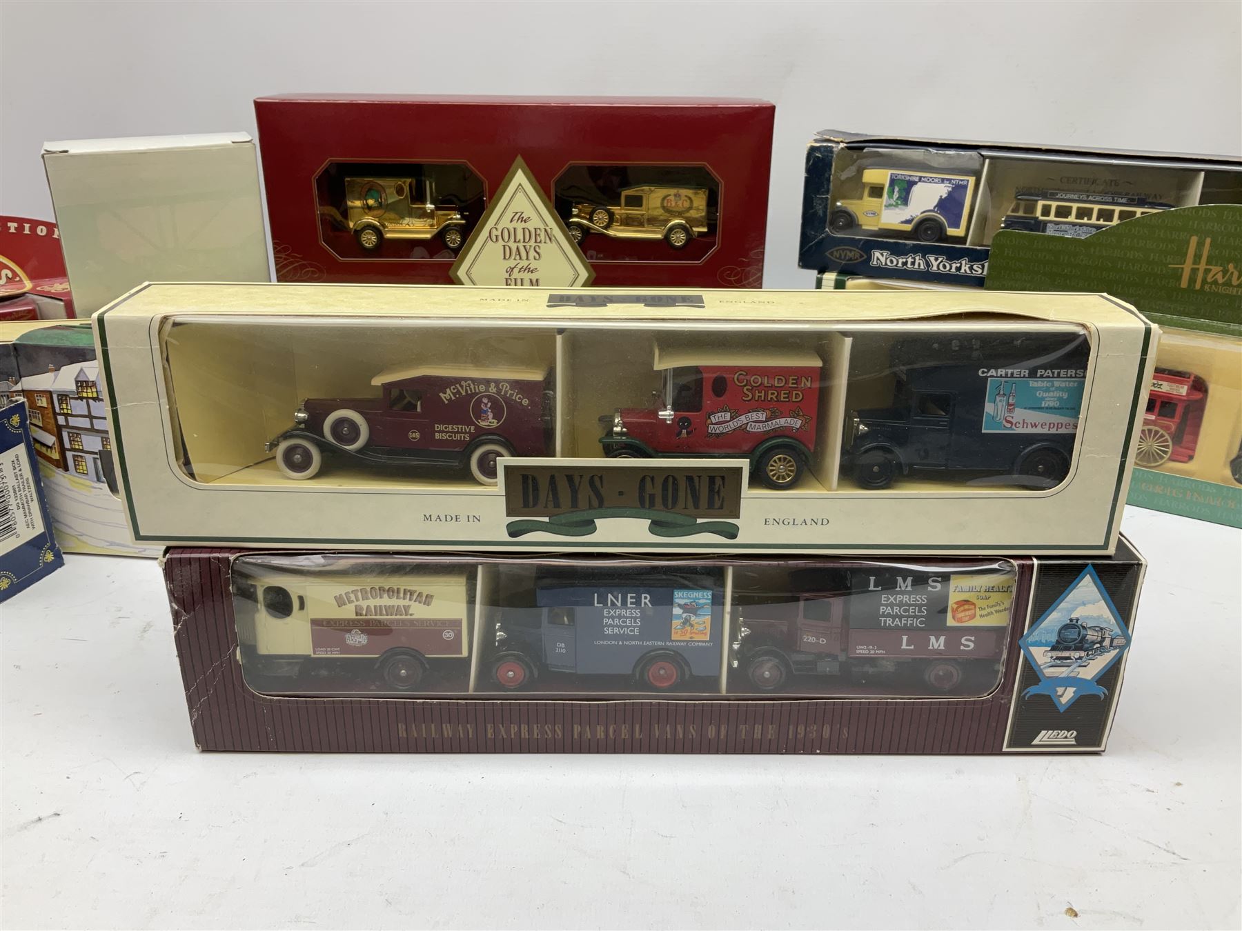 Collection of Diecast model vehicles, including Lledo The Golden Days of the Film Industry limited edition set, Lledo H Samuel boxed vehicle, and other similar examples 