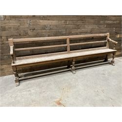 Victorian pitch pine bench pew, turned arms and legs, rail back with plank seat, 274cm