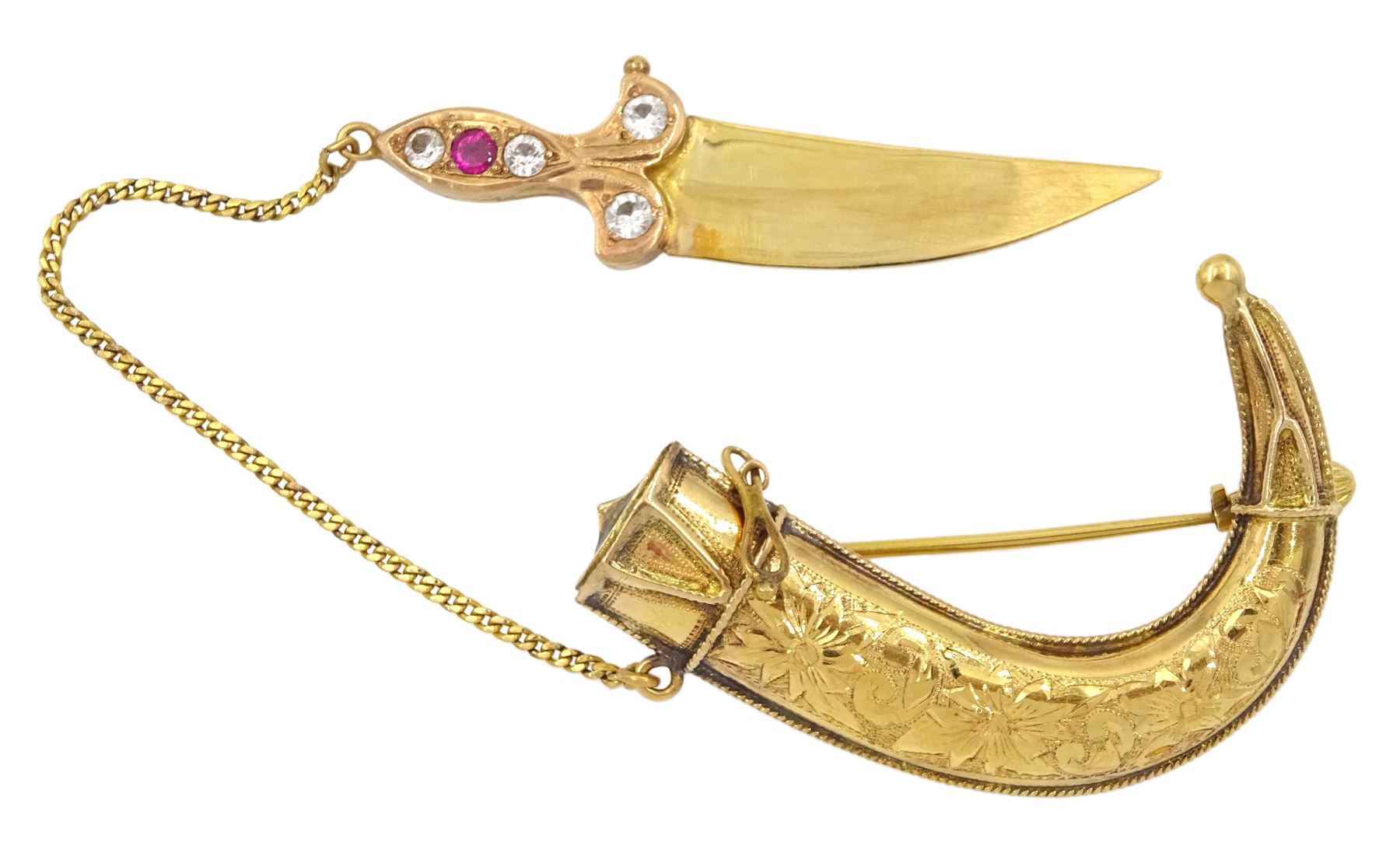 Early 20th century 20ct gold Middle Eastern Jambiya dagger brooch, the rose gold handle set with paste stones and scabbard with engraved floral decoration 