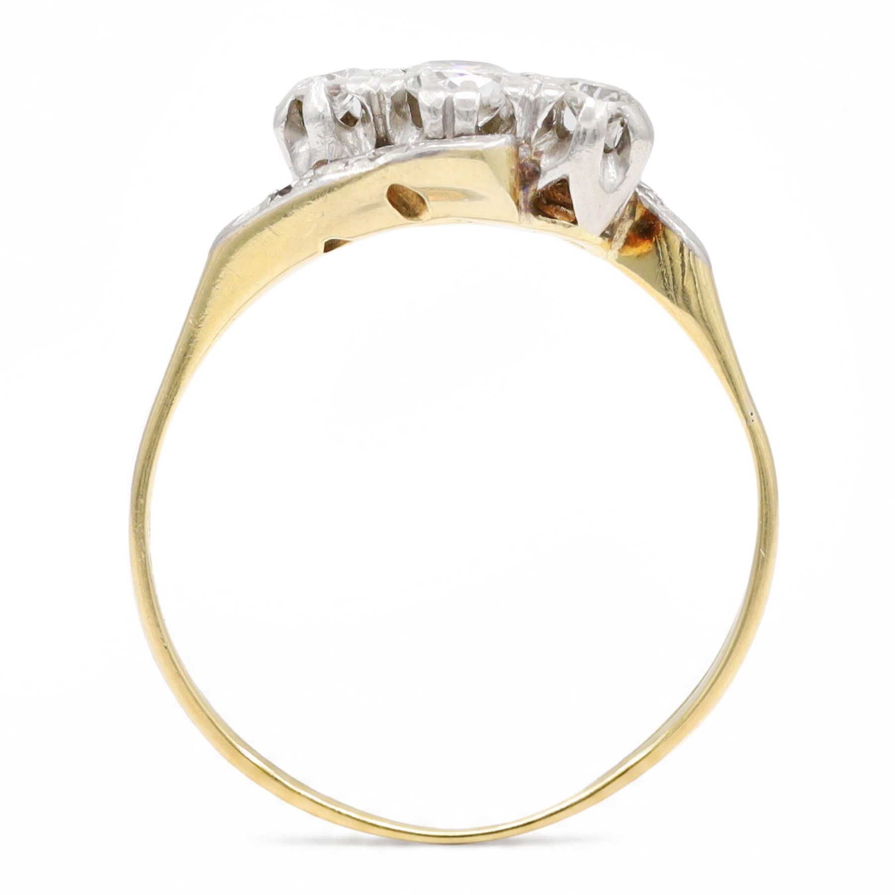 18ct gold diamond crossover ring, set with three old cut diamonds and two diamond chips either side, Birmingham 1982, total diamond weight approx 0.30 carat