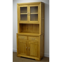 Light oak dresser, two glazed doors enclosing single shelf above two drawers and two cupboard doors, W90cm, H193cm  