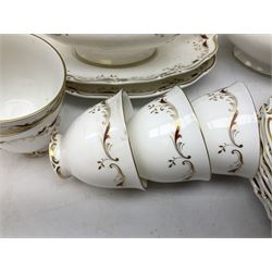 Royal Doulton dinner service for nine, decorated in the 'Strasbourg' pattern,  comprising dinner plates, rimmed soup bowls, smaller bowls, cups, saucers, tea plates, dinner plates and coffee plates, oval platter and two sauce boats with saucers