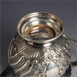 Victorian silver four piece tea service, comprising hot water pot, teapot, milk jug and sugar bowl, of circular part fluted bellied form, with embossed and engraved floral decoration, engraved with initials to body, the teapot and hot water pot with wooden handles and finials, hallmarked Z Barraclough & Sons, Sheffield 1898