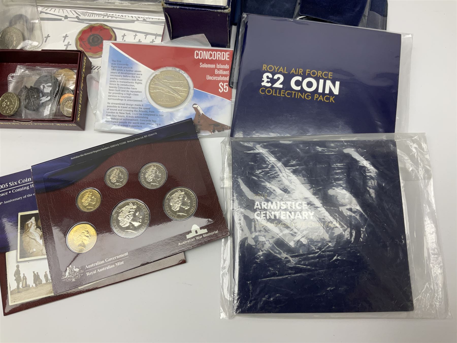 Commemorative and other coinage, including various Queen Elizabeth II 'London 2012 sports collection' fifty pence coins on cards, commemorative crowns, Millennium 2000 'Time Capsule' coin set, channel islands old round one pound coins, part sets etc