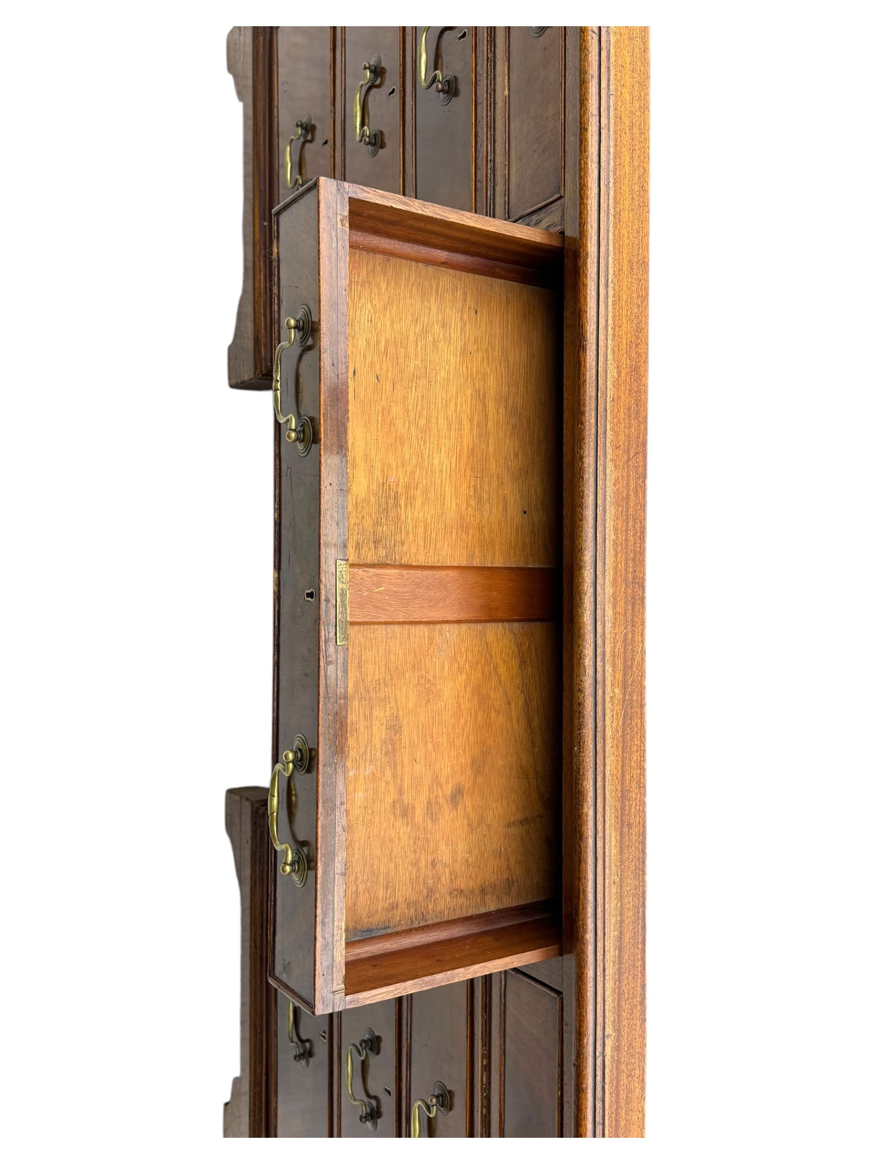 Edwardian mahogany twin pedestal desk, rectangular burgundy leather top moulded edge, over three short drawers with brass swan neck handles, over twin pedestals with graduating drawers supported on bracket feet