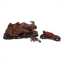 Chinese carved hardwood figural group of two boys climbing on the back of a water buffalo,...