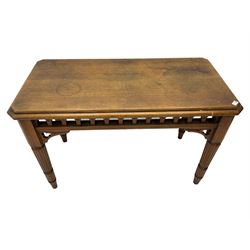 20th century oak ecclesiastical side table, the canted rectangular top with canted corners, pierced arcade frieze, on turned and reeded supports