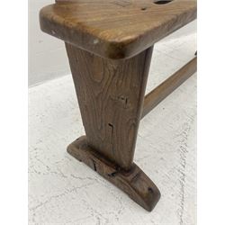 19th century country elm child’s joined bench, the pierced back rest and seat supported by shaped end supports joined by stretcher, on sledge feet 