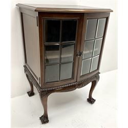 Small 20th century mahogany bow front display cabinet, single moulded hinge lid, two glazed doors enclosing single shelf, acanthus carved cabriole legs on ball and claw feet