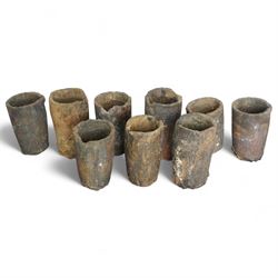 Nine lava stone iron smelting crucible pots in various conditions