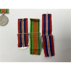 Twelve WW2 medals comprising four 1939-1945 war medals, four Defence medals, three 1939-1945 Stars and Africa Star; all with ribbons; some as groups in two issue boxes with slips