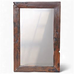 Rustic timber wall mirror, the heavy section frame formed from distressed boards with visi...