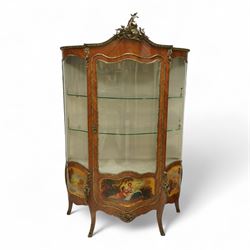 Louis XV revival kingwood Vernis-Martin serpentine fronted vitrine cabinet, arched top with gilt brass foliate mounts, glazed door with two shelves above three painted panels, depicting pastoral scenes, supported on out-swept cabriole legs with gilt brass mounts and sabots.