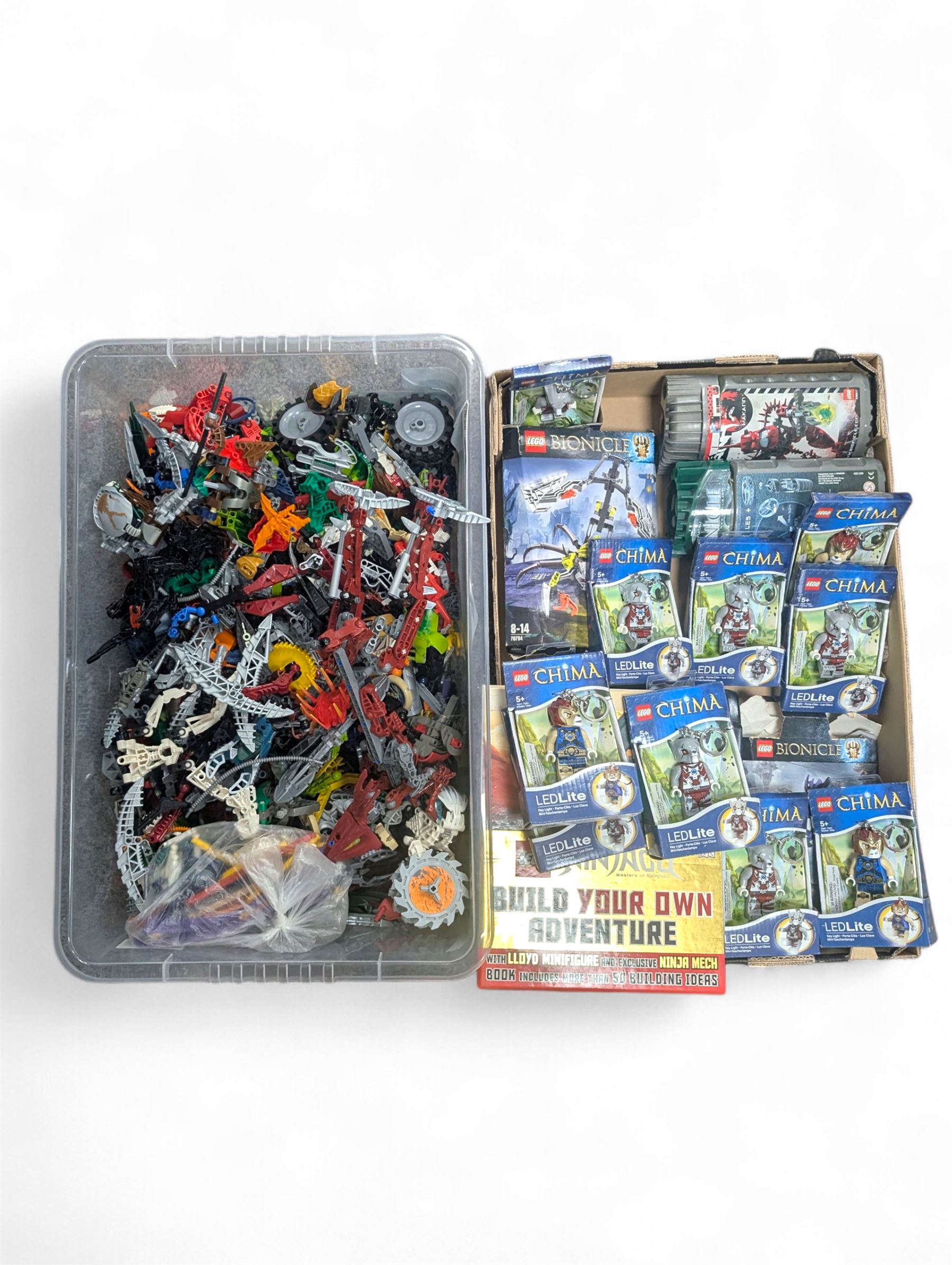 Lego Bionicle and similar part built figures and parts, including boxed sets and loose, together with a Lego Ninjago Build Your Own Adventure set and ten LEDlite Legends of Chima keyrings