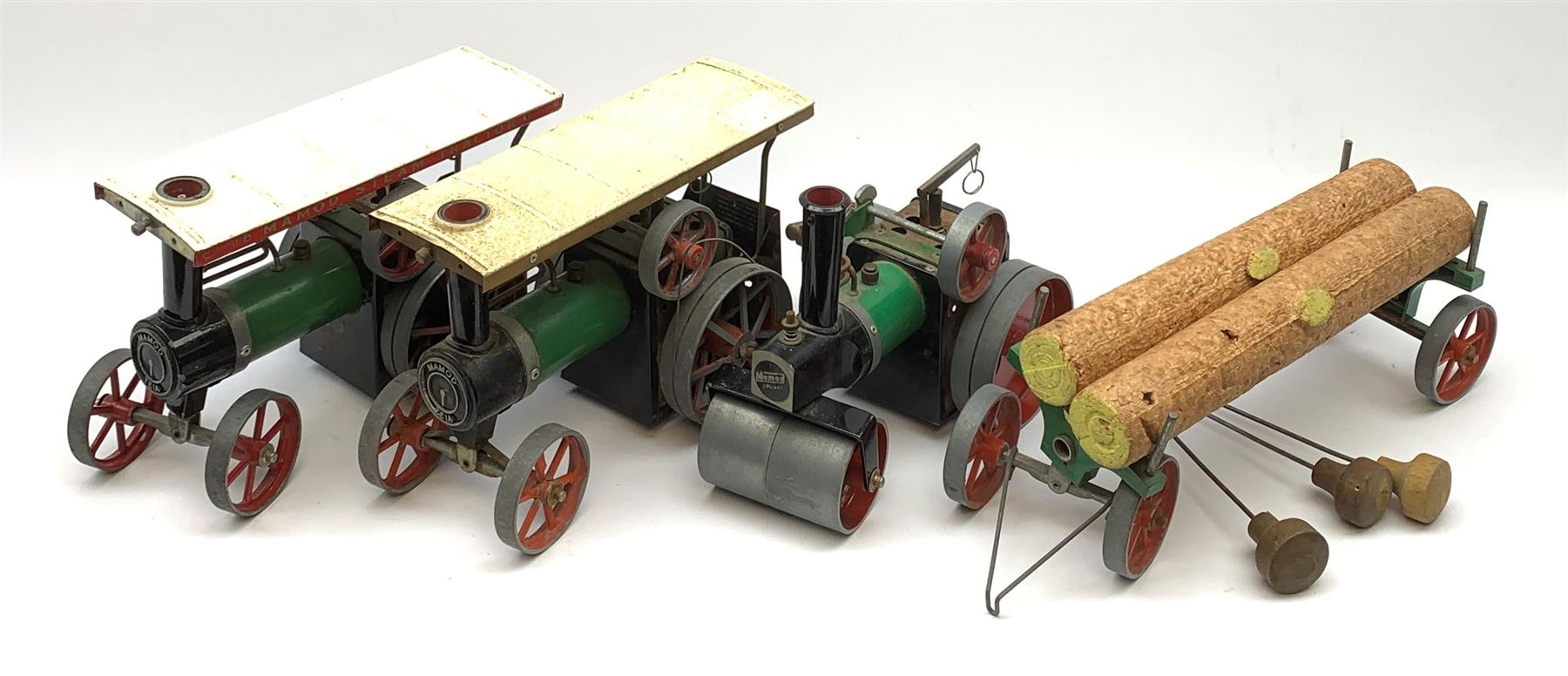 Two Mamod TE1A traction engines with steering rods; Mamod SR1 steam roller with steering rod; and Mamod lumber trailer, all unboxed (4)