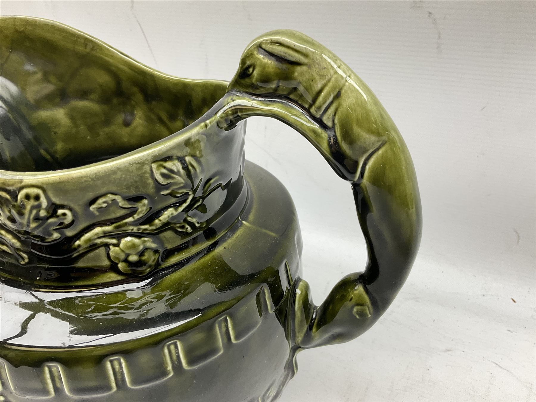 Three jardinières comprising West German Gerz example decorated in relief, Doulton Slaters example with frilled everted rim and a majolica example, and a further two Arthur Wood majolica jugs (5)