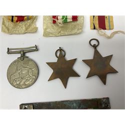 WWII group of three medals comprising 1939-45 War Medal and Italy and Africa Stars in issue box; dog tags for 282894 W. Wilkinson with framed photograph in uniform; and small quantity of cloth and metal badges including RAOC cap badge