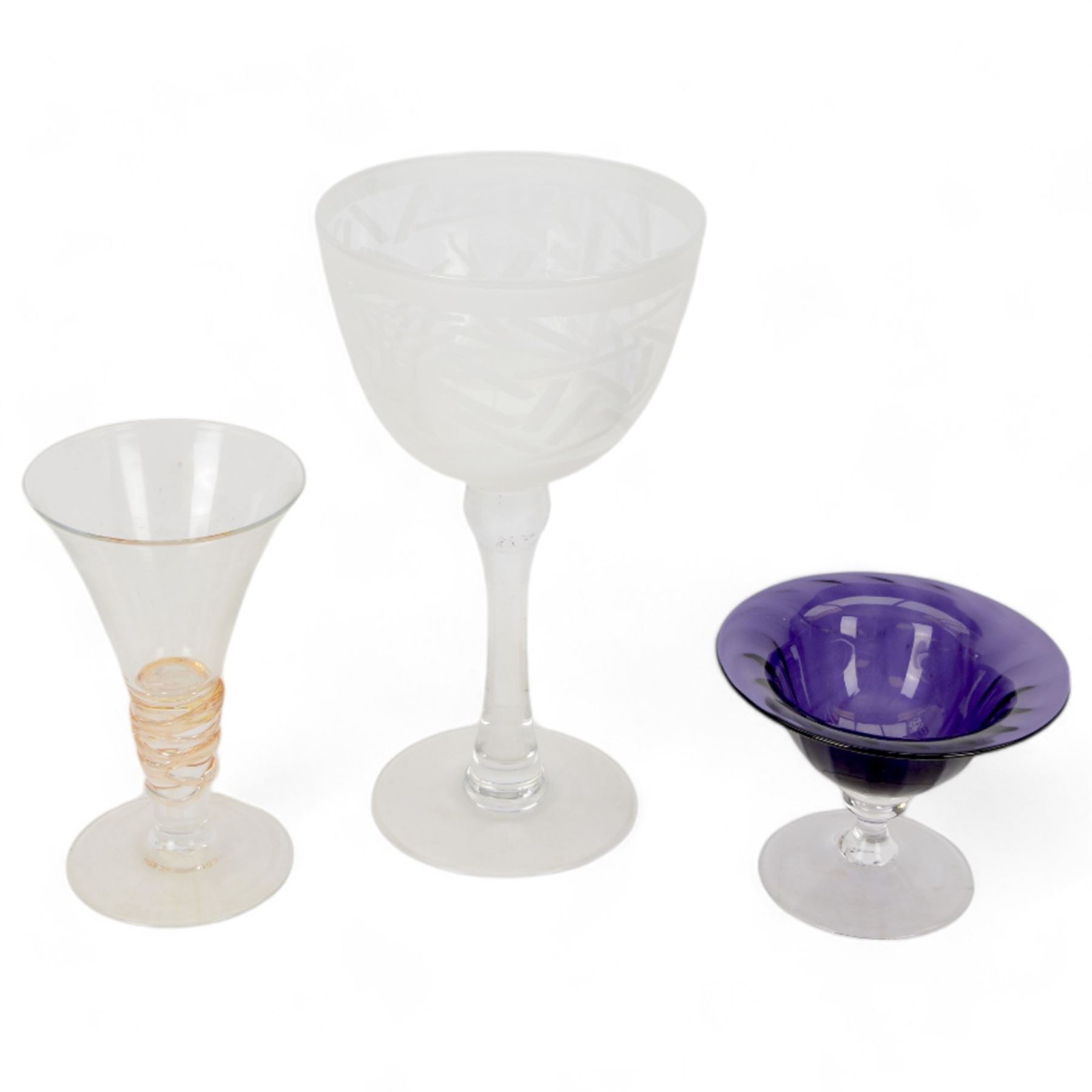 Gillies Jones of Rosedale oversized wine glass, decorated with white abstract decoration, together with a smaller Gillies Jones of Rosedale trumpet shaped wine glass with applied coloured glass ribbon to stem and a Deborah Fladgate purple fluted glass dish, all signed to base, tallest H24.5cm