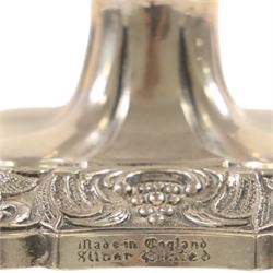Silver plate two branch candelabra with grape vine decoration to the base, together with a matching pair of candle sticks and other candlesticks  