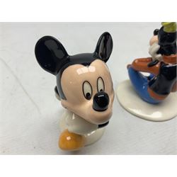 Three Royal Doulton The Mickey Mouse Collection figurines comprising Mickey Mouse MM1, Minnie Mouse MM2, and Goofy MM5, together withe three Royal Doulton limited edition miniature snowman character jugs comprising Christmas Stocking Snowman D7124, Christmas Cracker Snowman D7158 and Snowman D7062, all with original boxes 