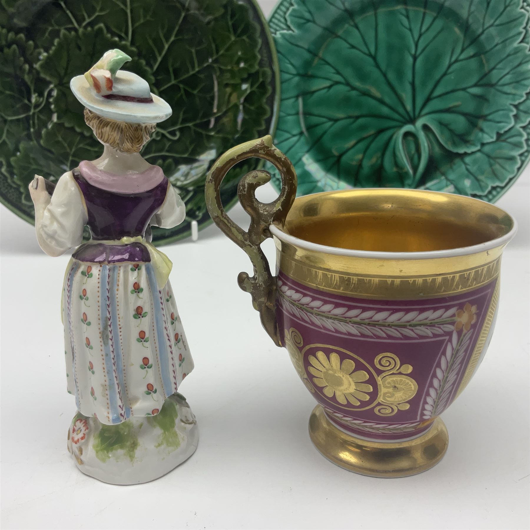 Wedgwood majolica leaf plate, together with another similar and together with a Dresden figure, etc 