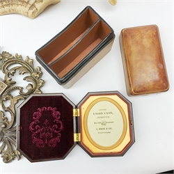A group of assorted collectables, comprising a Union case by S Peck & Co, a leather covered twin compartmented card box, pair of gilded spelter figures, a small mirror with cast and gilded foliate frame, H36cm, and pair of horn mounted Rams horns. 