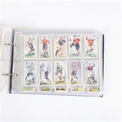 Collection of Edwardian and later Football related trading and cigarette cards, including forty-nine of fifty 1906 Ogden's Football Club Colours, 1922 PALS Footall series, ninety of one hundred 1925 Gallaher Famous Footballers, complete set of forty-four 1926 Ogden's Captains of Association Football Clubs and Colours, complete set of fifty 1927 Players Football Caricatures by MAC,  complete set of fifty 1927 Players Football Caricatures by RIP,  complete set of fifty 1930 Players Association Cup Winners, complete set of 50 1933 Ogdens AFC Nicknames etc, housed in brown cigarette card album