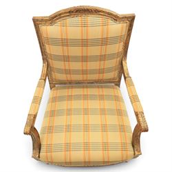 Louis XVI style painted fauteuil, the shaped padded back and overstuffed seat upholstered in cream tartan fabric, with scrolling open arms on fluted supports, the moulded frame with carved ribbon twist, rosette and husk decoration, raised on turned and fluted tapering legs