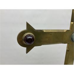 Brass alter cross, decorated with glass cabochons, upon a acicular stepped base and three claw feet, H73cm 