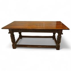 17th century revival oak refectory table, rectangular plank top above a scallop shell carved frieze and baluster turned legs carved with scallop shell and Gothic tracery, joined by stretchers