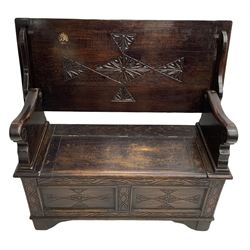 17th century design stained oak monks bench, hinged metaphoric table back, over hinged box seat compartment, the panelled front carved with foliate decoration and lozenges