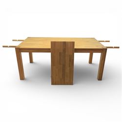 Solid light oak extending dining table with single leaf, and set of six chairs