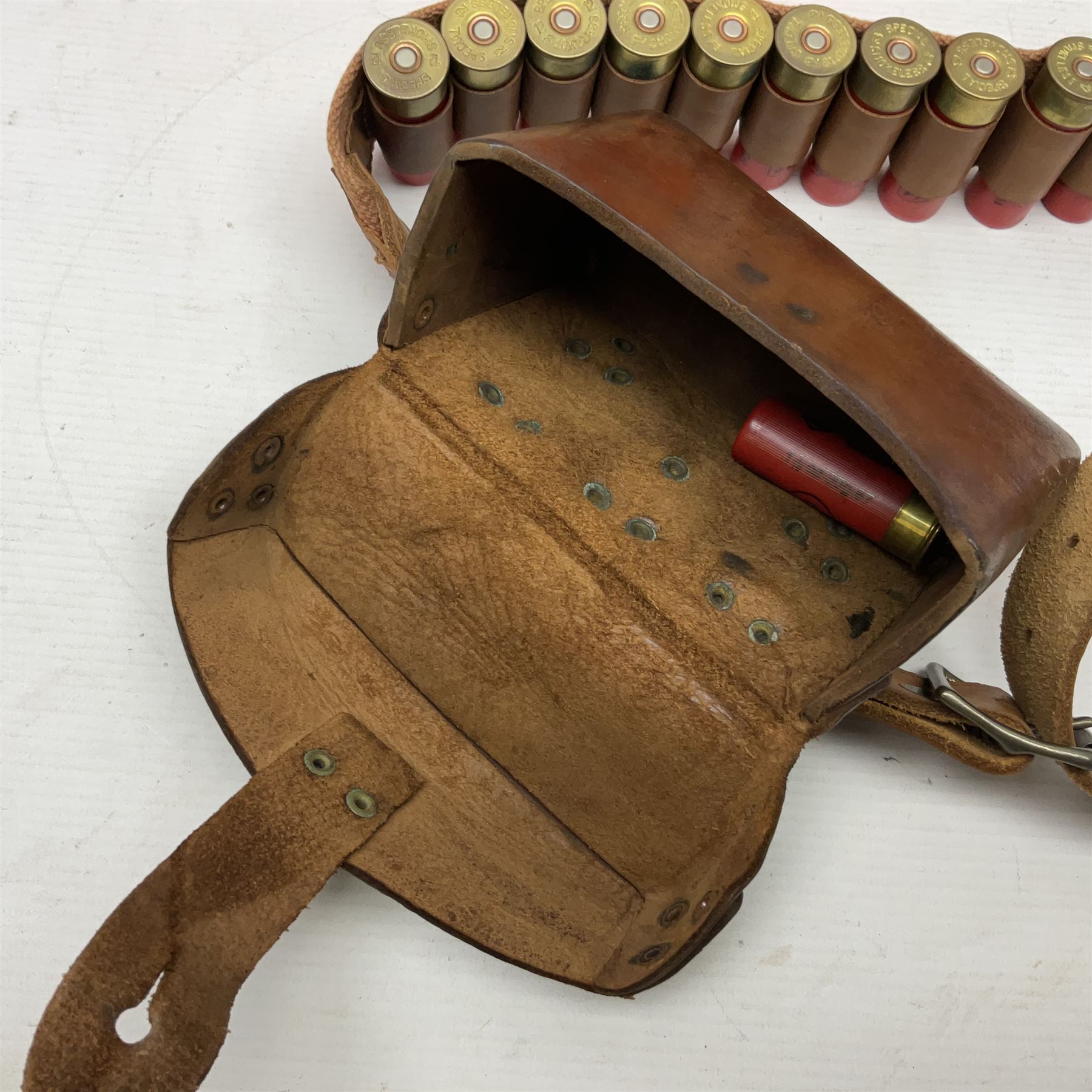 SHOTGUN CERTIFICATE REQUIRED - AMMUNITION - one-hundred and seventy-six 12-bore shotgun cartridges, boxed and in a leather cartridge belt with pouch; together with ninety-five .410 cartridges (seventy-nine 65mm and sixteen 50mm) in boxes