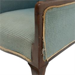 Edwardian armchair of squared form upholstered in blue fabric, serpentine seat front, shaped frame raised on cabriole supports