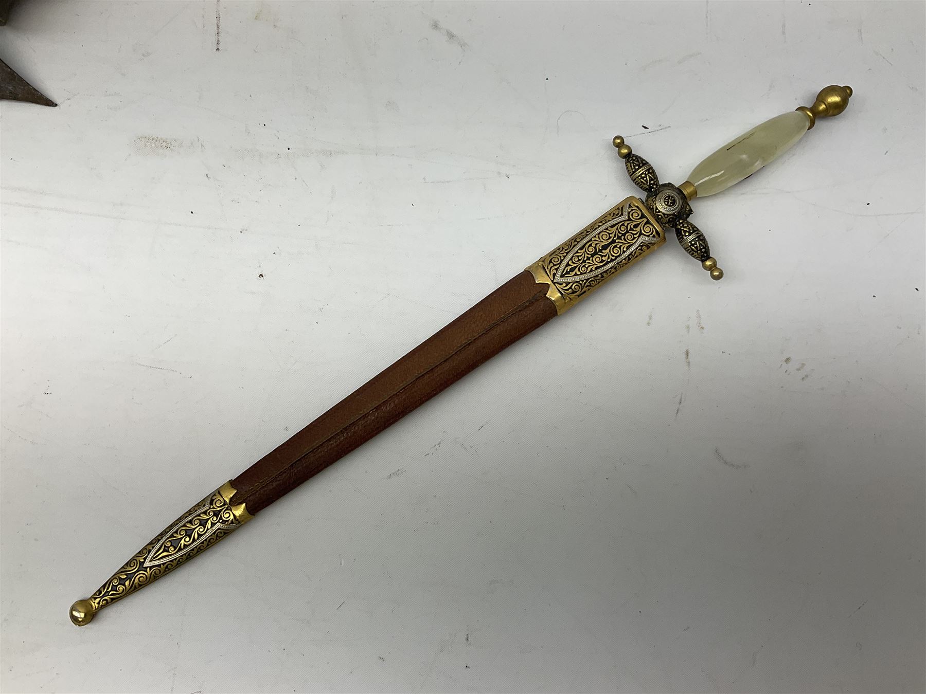 Malayan Kris dagger, the 31.5cm double edged straight heavy damascus blade with copper ferrule; carved hardwood grip; in large wooden throated scabbard with floral decorated white metal covering L47.5cm overall; a kris blade with adapted antler grip; and five various small daggers/letter openers (7)
