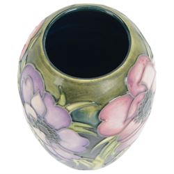 Moorcroft vase in Anemone pattern upon a dark blue ground, marked as a trial piece, impressed and painted marks to base, H14cm 
