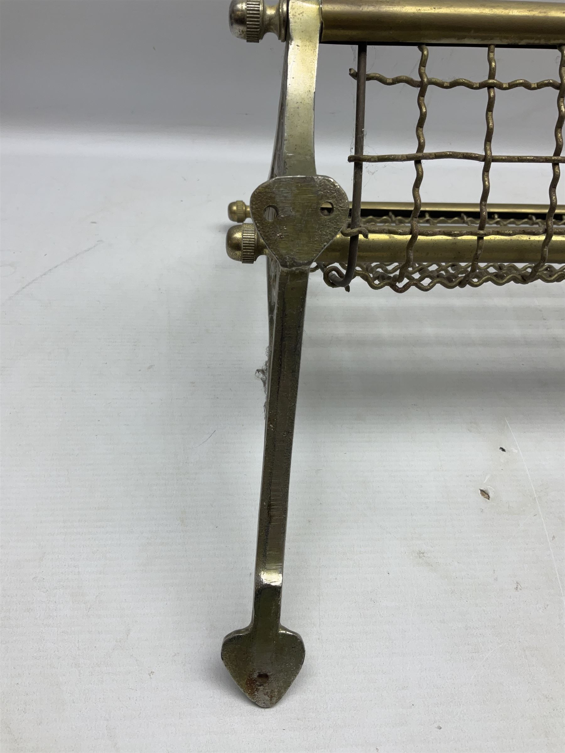 Railway interest - carriage compartment style wall mounting brass and mesh luggage rack, the ends cast with the initials NSWR (New South Wales Railroad) L77cm