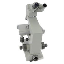 Three microscopes, including Griffin Student Vernier Microscope, Vickers Instruments binocular microscope with Leitz Wetzlar Periplan 10x lenses, and a Carl Zeiss Jena binocular microscope in a wooden Olympus Tokyo box