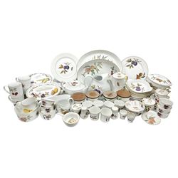 Royal Worcester Evesham pattern dinner and tea wares, to include lidded tureens, dinner plates, teacups, mugs, jugs, lidded canisters, sauce boat, oval serving dishes etc in three boxes