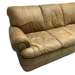 Large three-seat sofa upholstered in stitched brown leather with stud work decoration, rolled back and arms