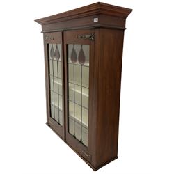 Early 20th century walnut cabinet, fitted with leaded and stained glazed doors