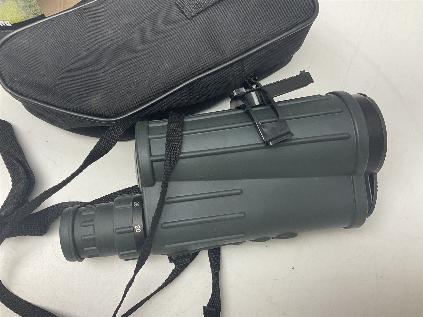 Yukon rubber armoured compact variable power spotting scope (boxed), together with Bresser 10x50 binoculars, Bushnell Excursion 10x42 binoculars, camera equipment etc  