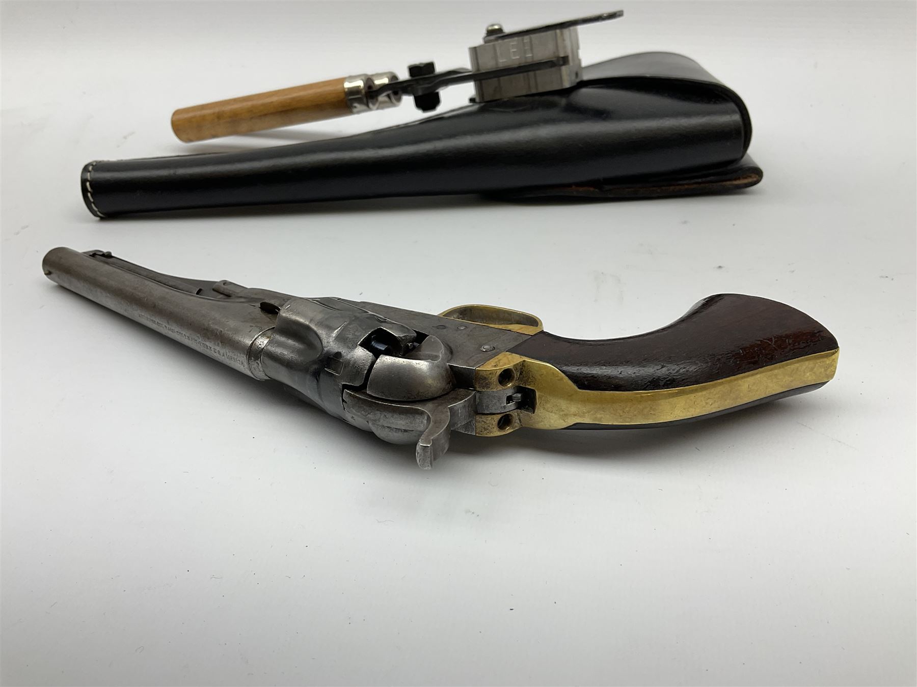 Colt .36 calibre percussion five-shot police pocket revolver, all parts with matching serial no.18334, 14cm barrel marked 'Address Col Saml Colt New York US America' with under barrel swivel rammer, brass trigger guard and backstrap with two-piece wooden grips L28.5cm; with modern bullet maker and leather holster.