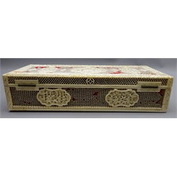  Late 19th century Chinese Canton pierced ivory rectangular box, carved in relief with floral borders, cartouche panels depicting figures in a village, with later red baize interior, L24cm   